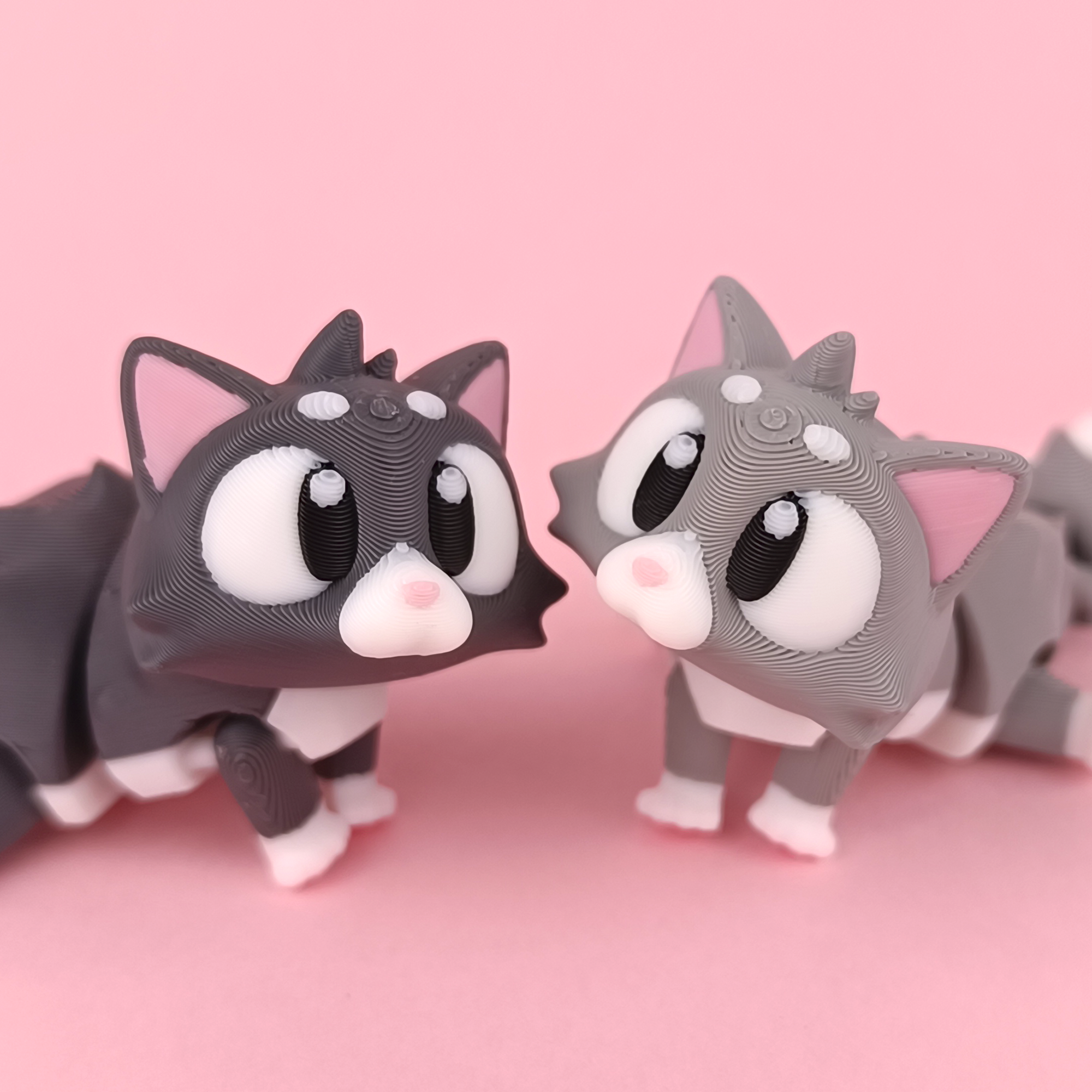 Flexi Kitten Articulated Figure Three Pack Pink Background – Wigglix