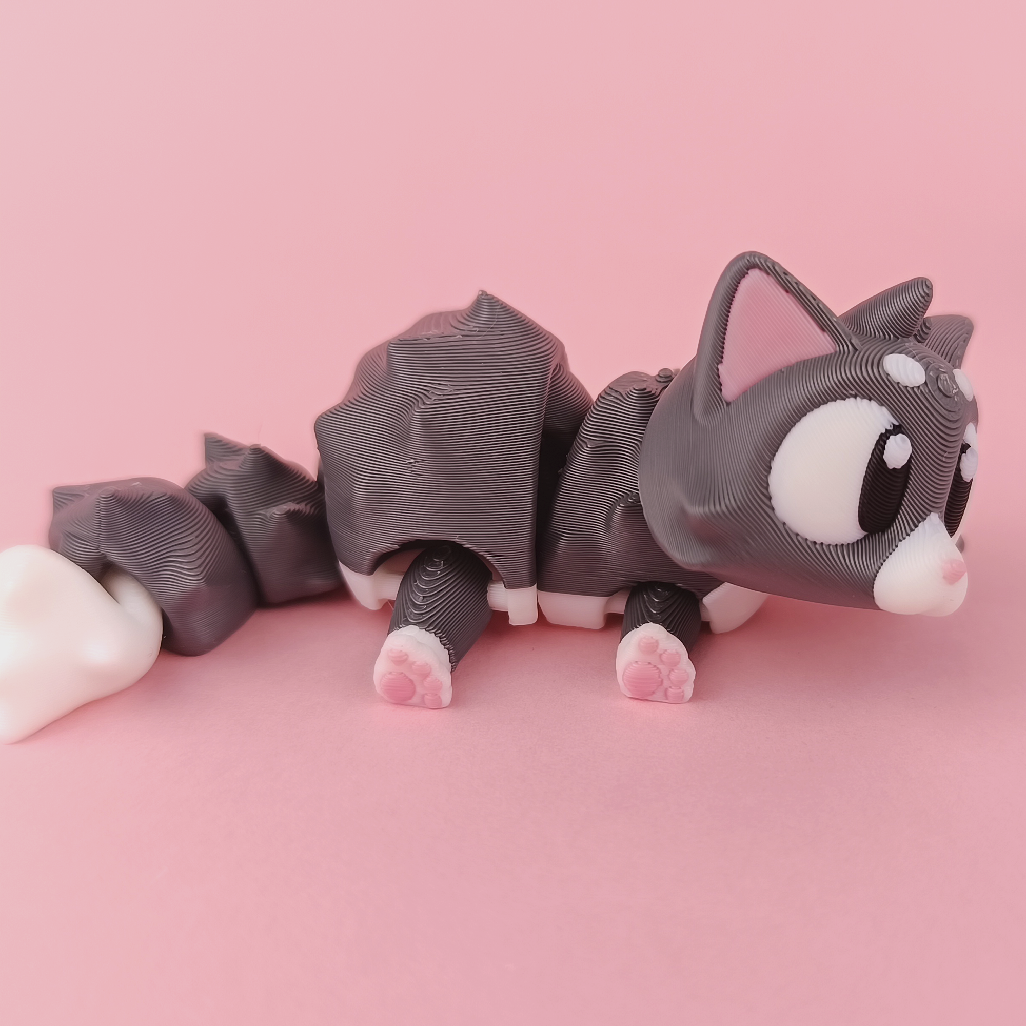Flexi Kitten Articulated Side View Pink Paw Pads Detail – Wigglix